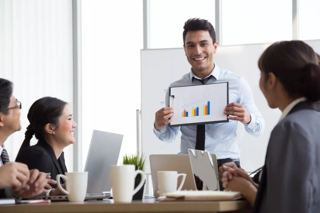 Man presenting to his team 