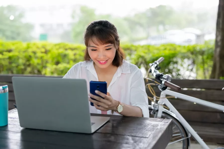 Employee happily checking phone 