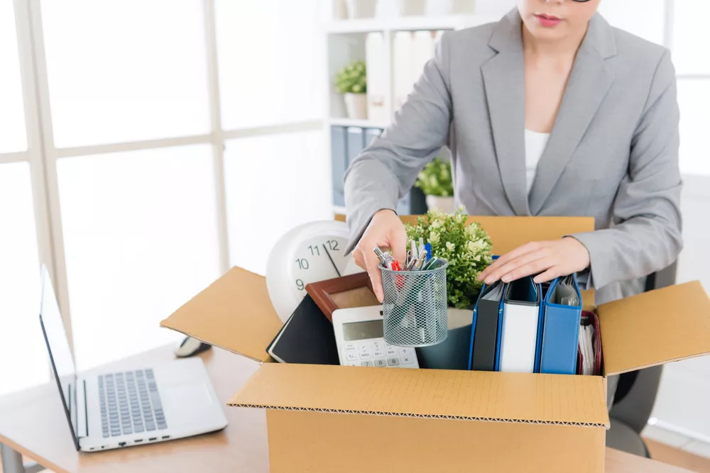 Resigned employee packing their things