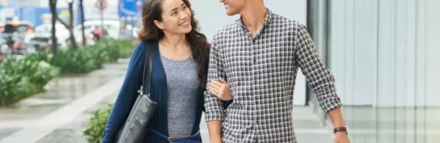 Couple walking with shopping bags